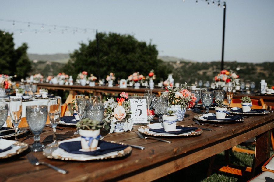 rustic tables At Casitas Estate Reception orchestrated by Arroyo Grande Wedding planner Sandcastle Celebrations