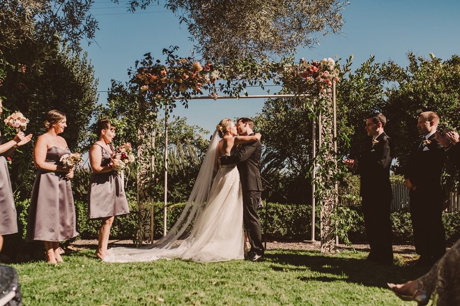 Kissing Bride and Groom Dana Power House by San Luis Obispo Wedding Planners Sandcastle Celebrations