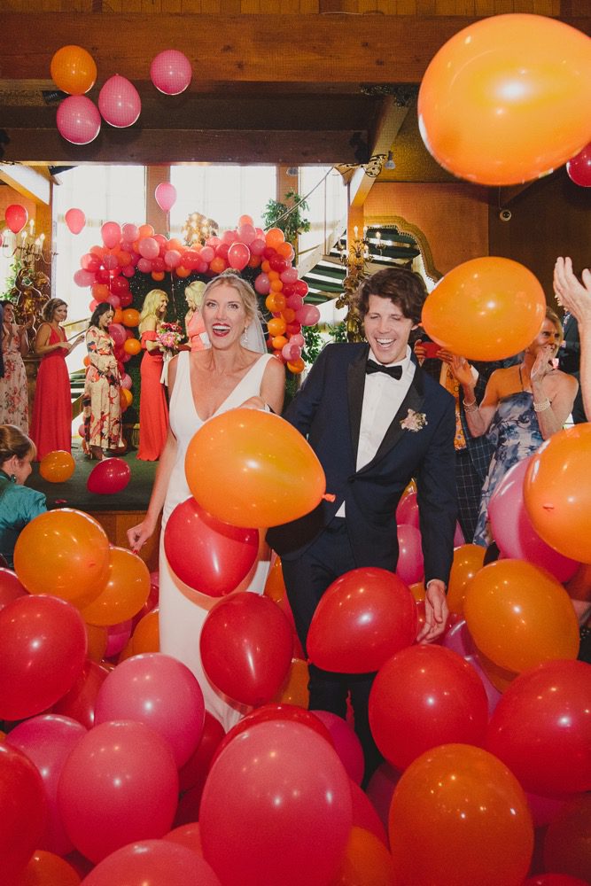 colorful ballon drop at a central coast wedding orchestrated by Pismo Beach Wedding Planners Sandcastle Celebrations