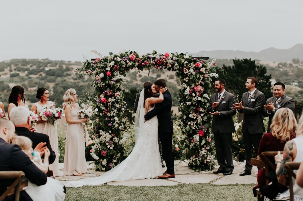 Epic Floral Arch with Bride and Groom