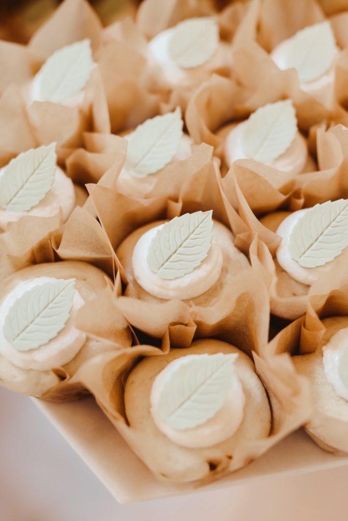 cup cakes adorned with fondant leaf