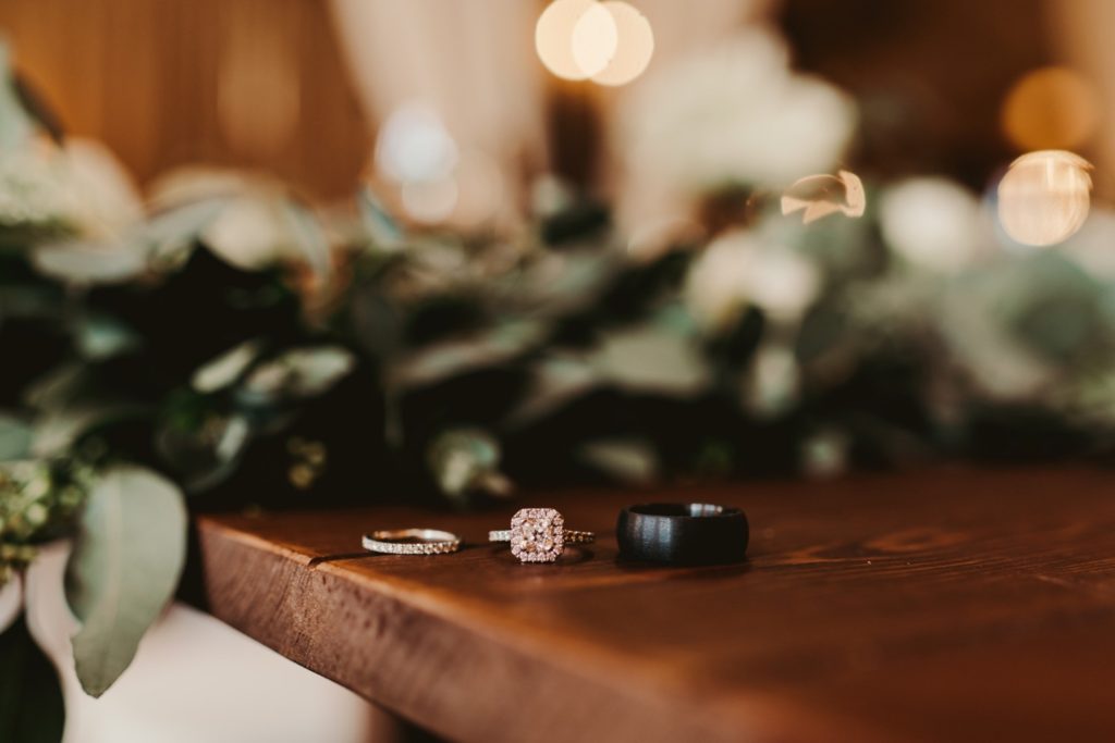 wedding rings on a table photo