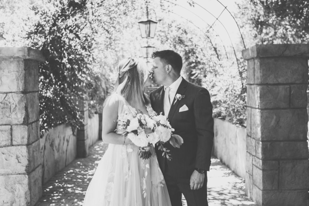 Black and White Photo Bride and Groom Kiss