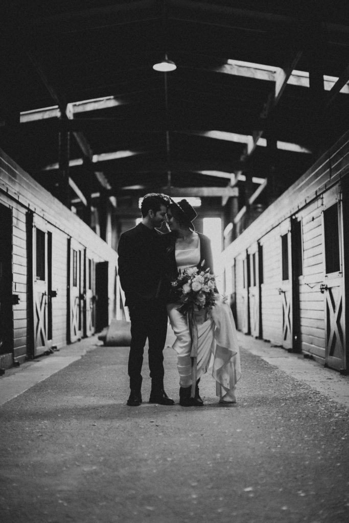 Black and White Bride and Groom in San Luis Obispo Barn by wedding planner sandcastle celebrations