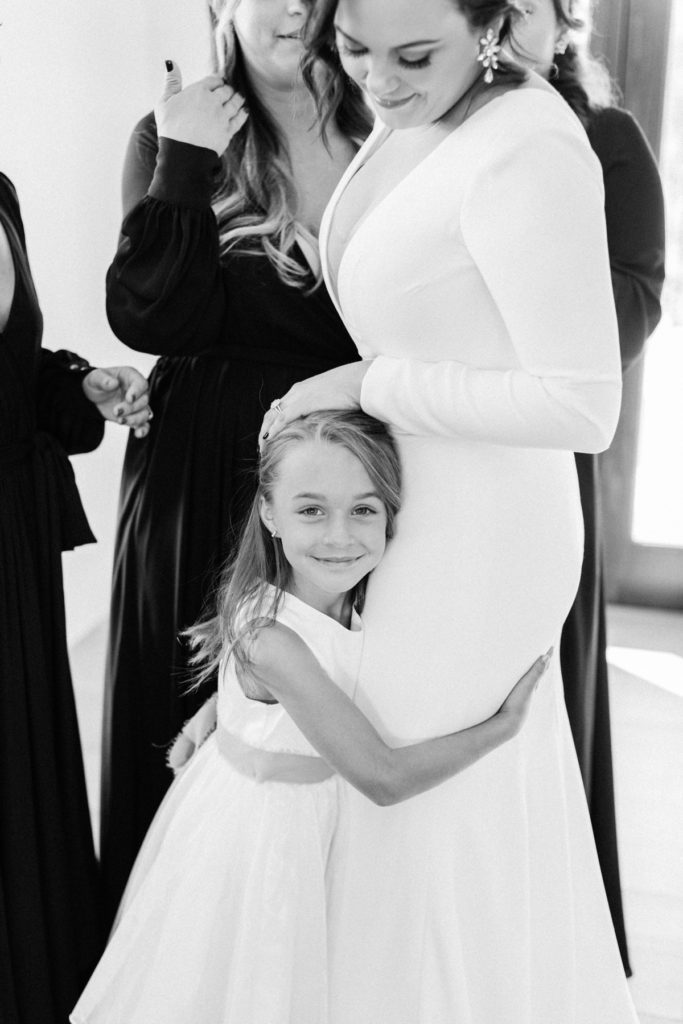 Black and white photo of bride and flower girl