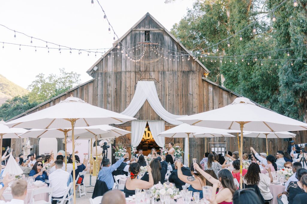 All guests cheersing at La Cuesta Ranch Wedding Designed by Janet Tacy of San Luis Obispo Wedding Planner Sandcastle Celebrations captured by Jen Rodriguez Photography