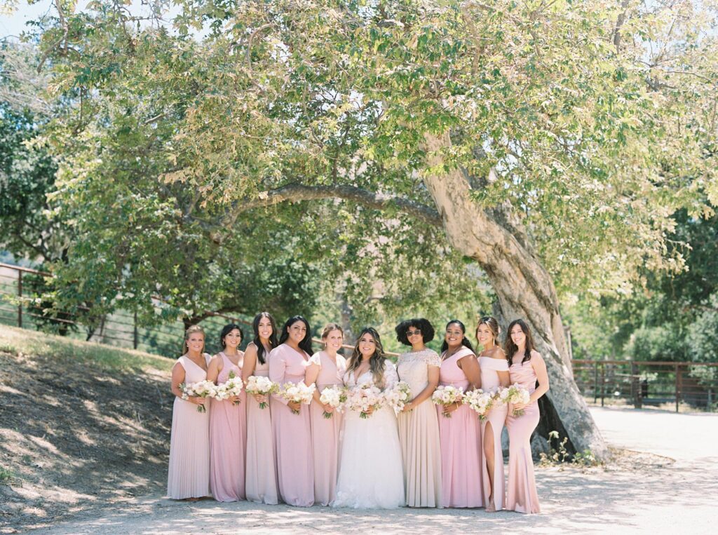 bridesmaids in Pinks and blush dresses at La Cuesta Ranch Wedding Designed by Janet Tacy of San Luis Obispo Wedding Planner Sandcastle Celebrations captured by Jen Rodriguez Photography