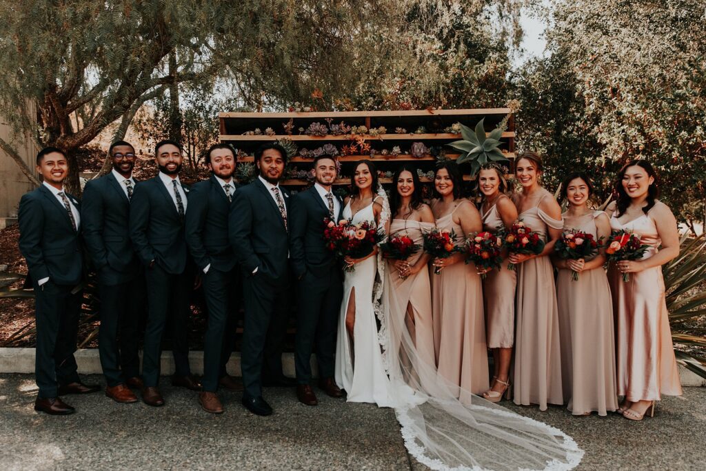 Wedding party in front of succulant wall at Japanese infused wedding at the Arroyo Grande Casitas Estate Wedding by SLO Wedding Planner Sandcastle Celebrations