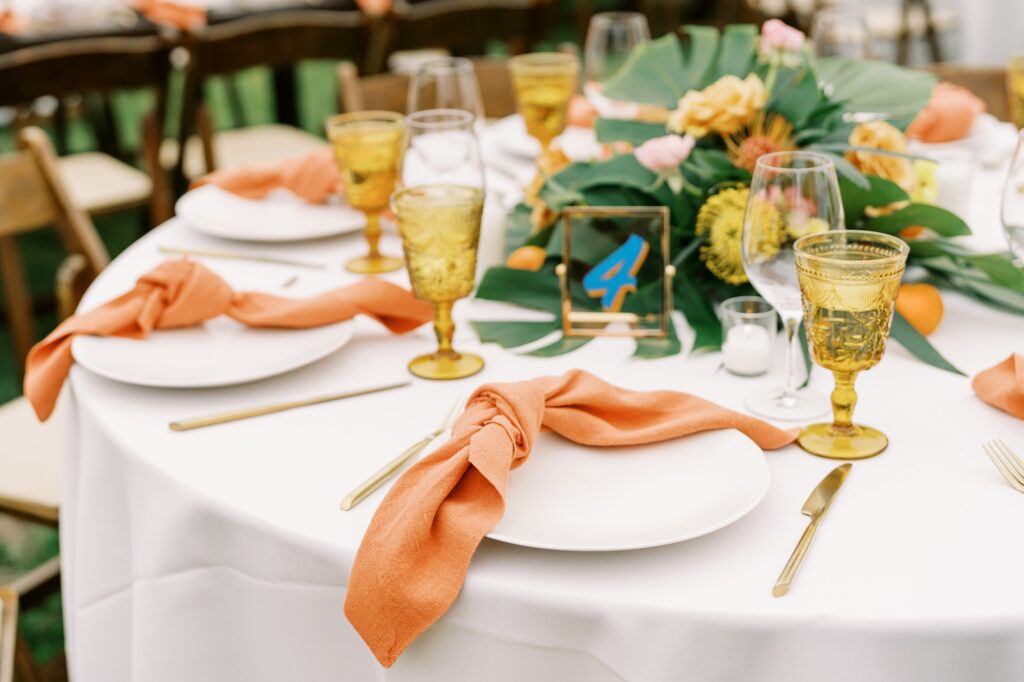 Orange napkins at unique 70s vibe colorful tangerine wedding at Casitas Estate by the best san luis obispo wedding planner Janet Tacy of Tacy and co.